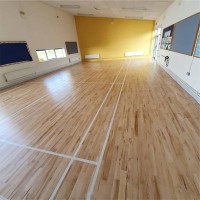 After renovation of solid beech floor in Drumphea National School, County Carlow: reapplied badminton court lines and finished with Junckers Sport HP by AD Sanding & Varnishing, Ireland