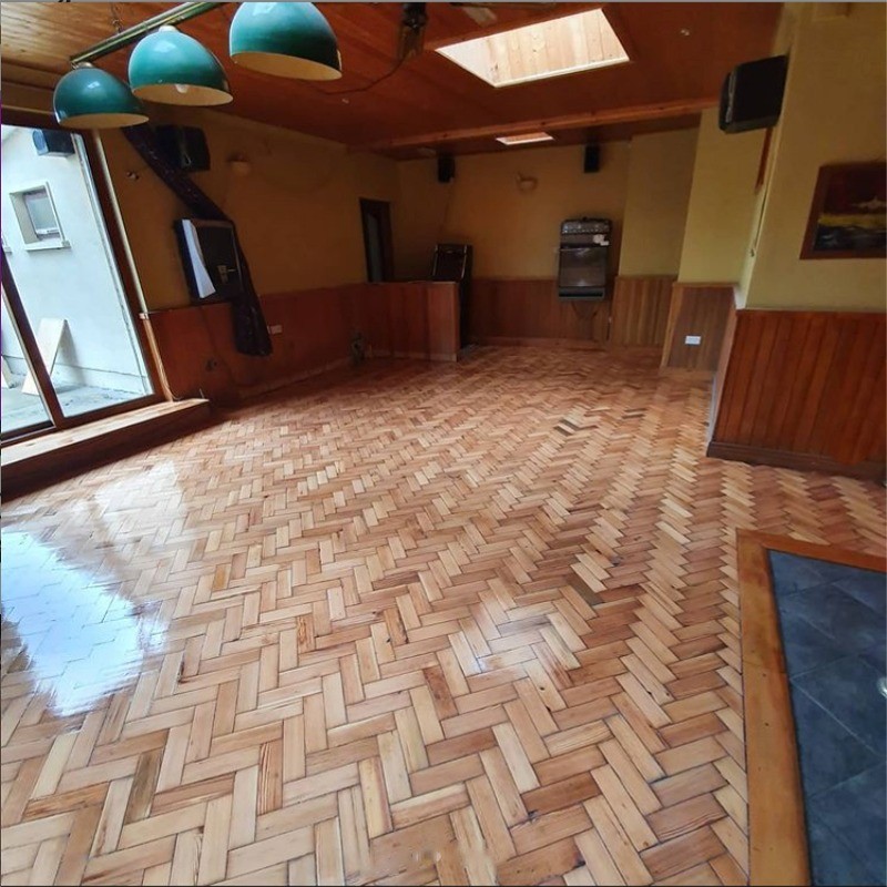 This reclaimed pitch pine herringbone floor badly needed restoring. Floor has been finished with 3 coats of Woca 2k silk gloss lacquer for commercial areas. Restoration by Jonathan Doyle of AD Sanding & Varnishing, Kilkenny, Ireland