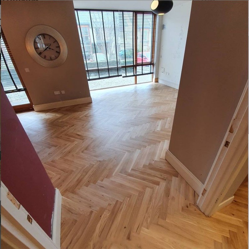 Herringbone parquet flooring, fitted over new, level subfloor with liquid Damp Proof Membrane (DPM) applied. Floor finished with 3 coats of Woca Optima silk gloss. Flooring installation by Jonathan Doyle of AD Sanding & Varnishing, Kilkenny, Ireland