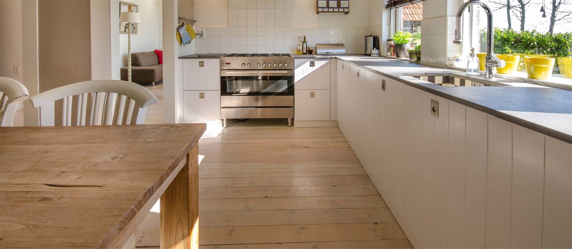 Solid wood flooring in kitchen. Floor installation services by Jonathan Doyle of AD Sanding & Varnishing, Kilkenny, Ireland