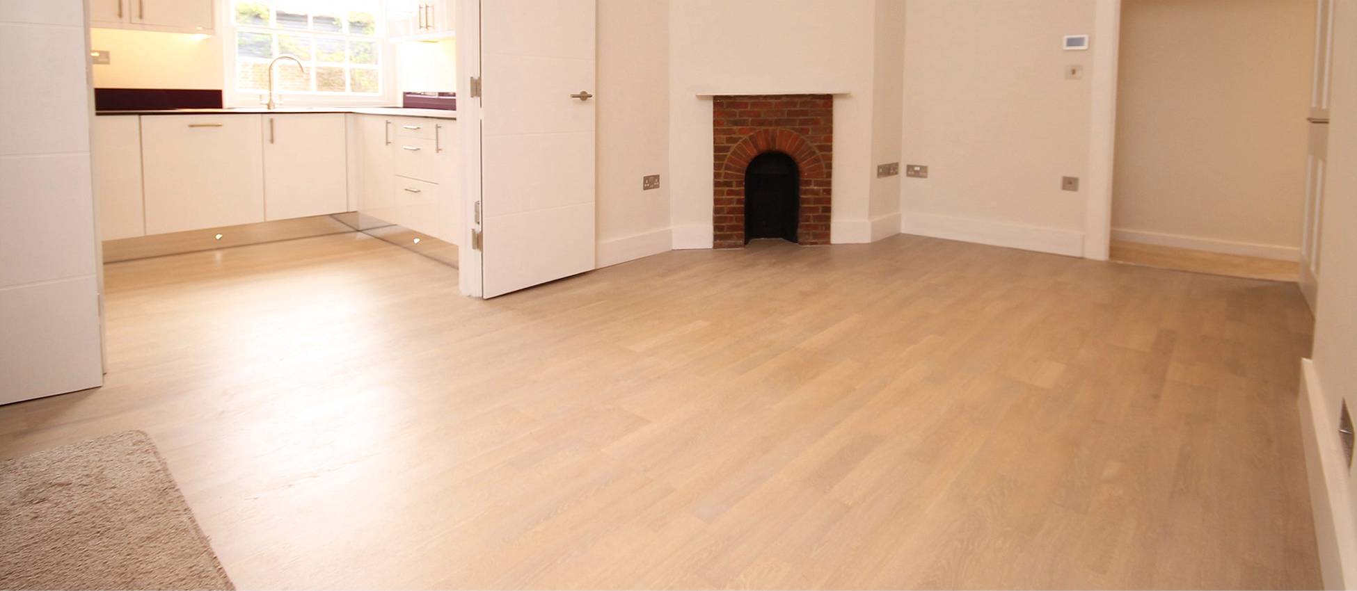 Engineered wood flooring in contemporary lounge. Floor installation services by Jonathan Doyle of AD Sanding & Varnishing, Kilkenny, Ireland