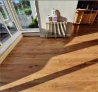 After renovation of oak floor.  Floor has been finished with 3 coats of Woca Optima Slik gloss lacquer. The natural beauty of the oak flooring has been restored by Jonathan Doyle of AD Sanding & Varnishing, Kilkenny, Ireland