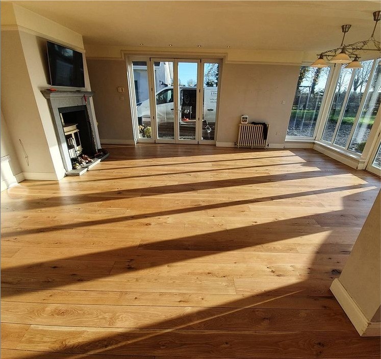 After renovation of oak floor.  Floor has been finished with 3 coats of Woca Optima Slik gloss lacquer. The natural beauty of the oak flooring has been restored by Jonathan Doyle of AD Sanding & Varnishing, Kilkenny, Ireland